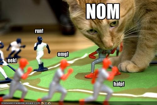 Cat Eats Toy Baseball Players
